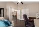 Office area with neutral colors, an office chair and a comfortable accent chair at 21 W Ranch Rd, Tempe, AZ 85284