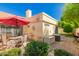 Inviting outdoor patio features brick pavers, an umbrella-shaded table, and lush greenery at 21 W Ranch Rd, Tempe, AZ 85284