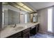 Large bathroom vanity with dual sinks and a big mirror at 2113 N Squire Ave, Tempe, AZ 85288