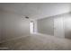 Standard bedroom featuring plush carpeting, neutral walls, and a closet door at 2113 N Squire Ave, Tempe, AZ 85288