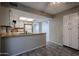 Bright kitchen featuring white cabinets, neutral countertops, and an open layout at 2113 N Squire Ave, Tempe, AZ 85288