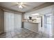 Open-concept kitchen with white cabinets and breakfast bar at 2113 N Squire Ave, Tempe, AZ 85288