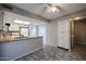 Bright kitchen featuring white cabinets, neutral countertops, and an open layout at 2113 N Squire Ave, Tempe, AZ 85288