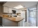 Cozy kitchen featuring white cabinets, wood countertops, and stainless steel appliances at 2113 N Squire Ave, Tempe, AZ 85288