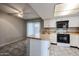 Charming kitchen featuring modern appliances and tiled flooring at 2113 N Squire Ave, Tempe, AZ 85288