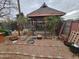 Backyard with a gazebo, rock landscaping, and a brick paver path at 21817 W Harding Ave, Wittmann, AZ 85361