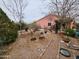 Lush backyard with a mix of greenery and thoughtful landscaping that creates a serene outdoor space at 21817 W Harding Ave, Wittmann, AZ 85361