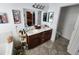 Bright bathroom with double vanity sinks and a full mirror, and direct access to the toilet at 21817 W Harding Ave, Wittmann, AZ 85361