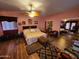 Bedroom with wood-look flooring, ceiling fan, and sliding door closet at 21817 W Harding Ave, Wittmann, AZ 85361