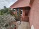 Inviting front entrance with a garden area, offering a warm and welcoming atmosphere at 21817 W Harding Ave, Wittmann, AZ 85361