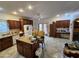 Spacious kitchen featuring wood cabinets and tile floors, perfect for cooking and entertaining at 21817 W Harding Ave, Wittmann, AZ 85361