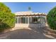 Cozy sunroom addition with glass windows and a private desert-scape yard, perfect for outdoor relaxation at 22120 N Old Mine Rd, Sun City West, AZ 85375