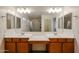 Bathroom features dual sinks with vanity and a large mirror and shower at 2260 S Deerfield Ln, Gilbert, AZ 85295