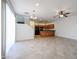 Open-concept living space with tile flooring, seamlessly connecting to the kitchen at 2260 S Deerfield Ln, Gilbert, AZ 85295