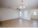 Spacious living area with tile floors, fan, and natural lighting at 2260 S Deerfield Ln, Gilbert, AZ 85295