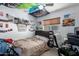 Eclectic bedroom with cozy bed, fun decor, and a ceiling fan at 2302 E Sells Dr, Phoenix, AZ 85016