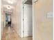 Hallway with tile flooring and white doors at 2302 E Sells Dr, Phoenix, AZ 85016