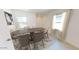 Elegant dining room with modern table, chairs, and natural light for Gathering meals and entertaining at 24174 W Hidalgo Ave, Buckeye, AZ 85326