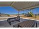 View of the picnic tables in the community playground, complete with slide and sunshade at 24175 W Hidalgo Ave, Buckeye, AZ 85326