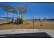 View of community playground featuring multiple play structures, sunshade, and walking trail at 24175 W Hidalgo Ave, Buckeye, AZ 85326