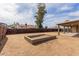 Spacious backyard featuring a fenced yard and covered patio, perfect for outdoor living and entertaining at 2643 E Jerome Ave, Mesa, AZ 85204