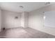 A partially finished basement with plush carpeting, white walls, and a drop ceiling at 2643 E Jerome Ave, Mesa, AZ 85204