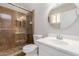 Bathroom featuring a tiled shower with glass door and white sink vanity at 2643 E Jerome Ave, Mesa, AZ 85204