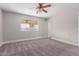 Bedroom with carpet, ceiling fan, and a neutral color palette at 2643 E Jerome Ave, Mesa, AZ 85204