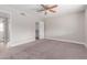 Neutral bedroom with carpet, ceiling fan, and access to a walk-in closet at 2643 E Jerome Ave, Mesa, AZ 85204