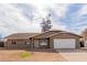 Charming single-story home with well-maintained lawn, two car garage, and inviting curb appeal at 2643 E Jerome Ave, Mesa, AZ 85204