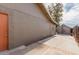 Side view of a home showing the exterior paint, backyard access, and a storage shed at 2643 E Jerome Ave, Mesa, AZ 85204