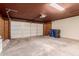 A spacious garage with a white paneled garage door at 2643 E Jerome Ave, Mesa, AZ 85204