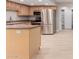 Spacious kitchen with modern stainless steel appliances and an island, perfect for cooking and entertaining at 2643 E Jerome Ave, Mesa, AZ 85204