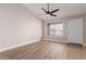 Bright living room with laminate flooring, ceiling fan and natural light at 2643 E Jerome Ave, Mesa, AZ 85204