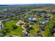 Aerial view of a community featuring a park, splash pad, pools, walking trails and mountain views at 28735 N 21St Ave, Phoenix, AZ 85085