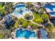 Aerial view of community pools and clubhouse, lush landscaping, walking paths, and gathering spaces at 28735 N 21St Ave, Phoenix, AZ 85085