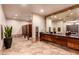 Community bathroom featuring multiple sinks, large mirrors, and convenient paper towel dispensers at 28735 N 21St Ave, Phoenix, AZ 85085