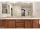 Bathroom vanity featuring double sinks, granite countertops, and wood cabinets at 28735 N 21St Ave, Phoenix, AZ 85085