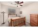 Comfortable bedroom with carpet, ceiling fan, and window for natural light at 28735 N 21St Ave, Phoenix, AZ 85085