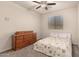 Bright bedroom with carpet, ceiling fan, and window with blinds at 28735 N 21St Ave, Phoenix, AZ 85085