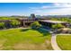 Expansive view of the clubhouse featuring manicured lawns and architectural desert landscaping at 28735 N 21St Ave, Phoenix, AZ 85085