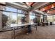 Spacious game room featuring a ping pong table and ample natural light from large windows at 28735 N 21St Ave, Phoenix, AZ 85085