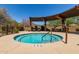 Relaxing hot tub area with overhead pergola and desert landscaping at 28735 N 21St Ave, Phoenix, AZ 85085