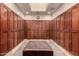 Locker room with wooden lockers, a bench seat, and ample storage space for personal belongings at 28735 N 21St Ave, Phoenix, AZ 85085