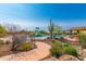 Community pool featuring a splash pad, mature landscaping, and comfortable lounge area at 28735 N 21St Ave, Phoenix, AZ 85085