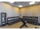 Community fitness center weight room with lots of dumbbells, and work out bench at 28735 N 21St Ave, Phoenix, AZ 85085