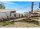 Well-maintained backyard with drought-resistant landscape design and sun shade at 3133 W Christy Dr, Phoenix, AZ 85029