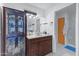 A full bathroom with a wooden vanity, marble countertop, and a sliding glass shower at 3133 W Christy Dr, Phoenix, AZ 85029