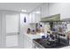 Well-lit kitchen features white countertops, cabinets, and stainless steel oven for a bright space at 3133 W Christy Dr, Phoenix, AZ 85029