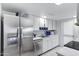 Bright kitchen featuring stainless steel appliances and white cabinetry, complemented by light marble countertops at 3133 W Christy Dr, Phoenix, AZ 85029